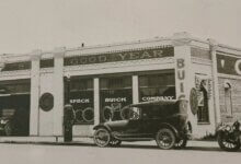 Historic Speck Buick Company dealership with vintage cars parked outside