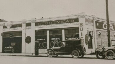 Historic Speck Buick Company dealership with vintage cars parked outside